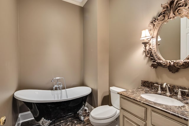 bathroom with vanity, a bathing tub, toilet, and ornamental molding