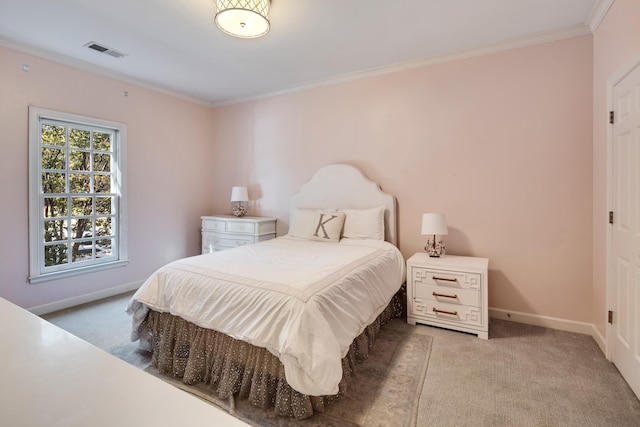 carpeted bedroom featuring crown molding