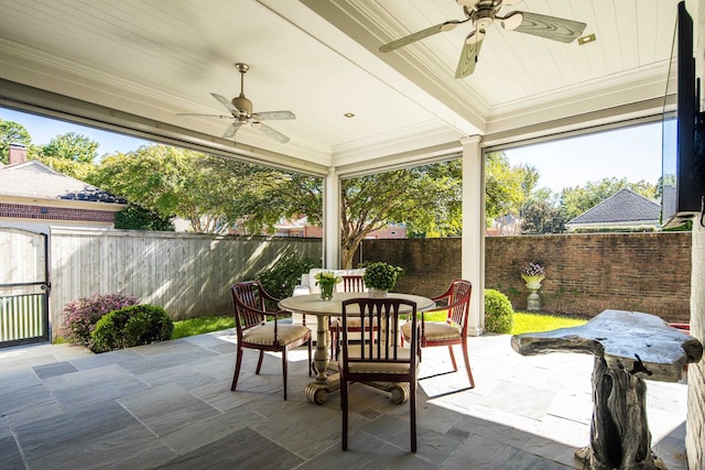 exterior space with ceiling fan