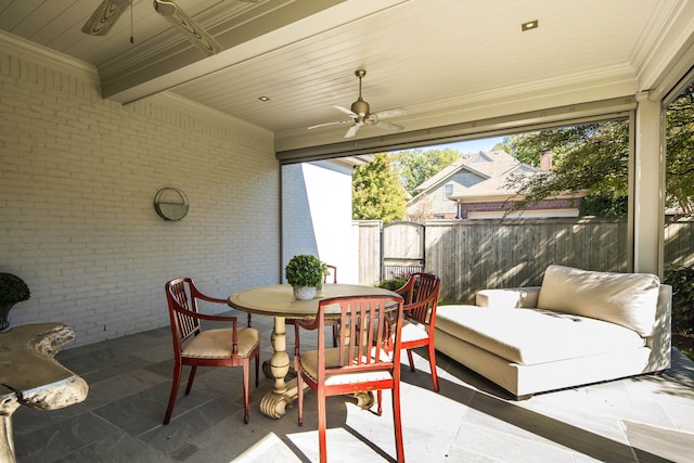 sunroom with wood ceiling and ceiling fan