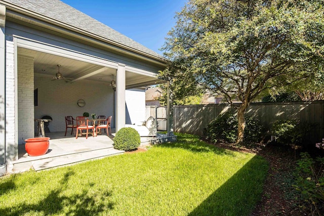 view of yard with a patio and ceiling fan