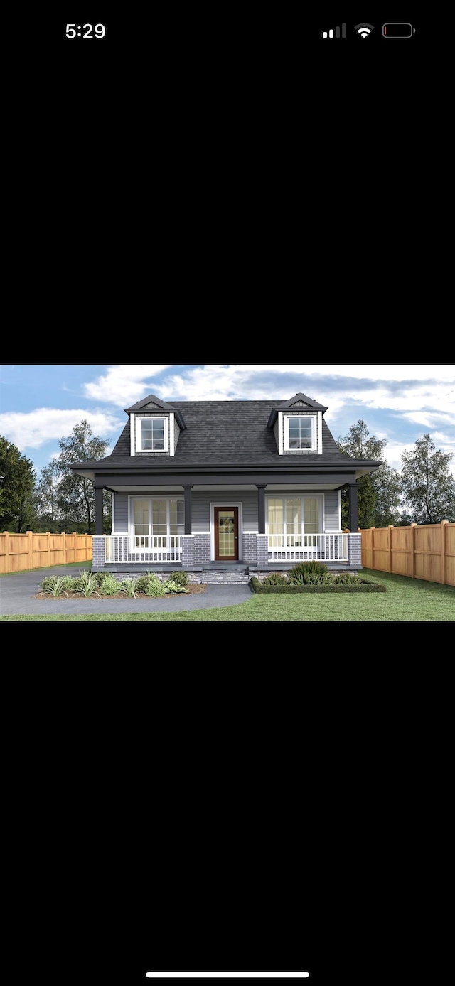 view of front of property featuring a porch and a front lawn