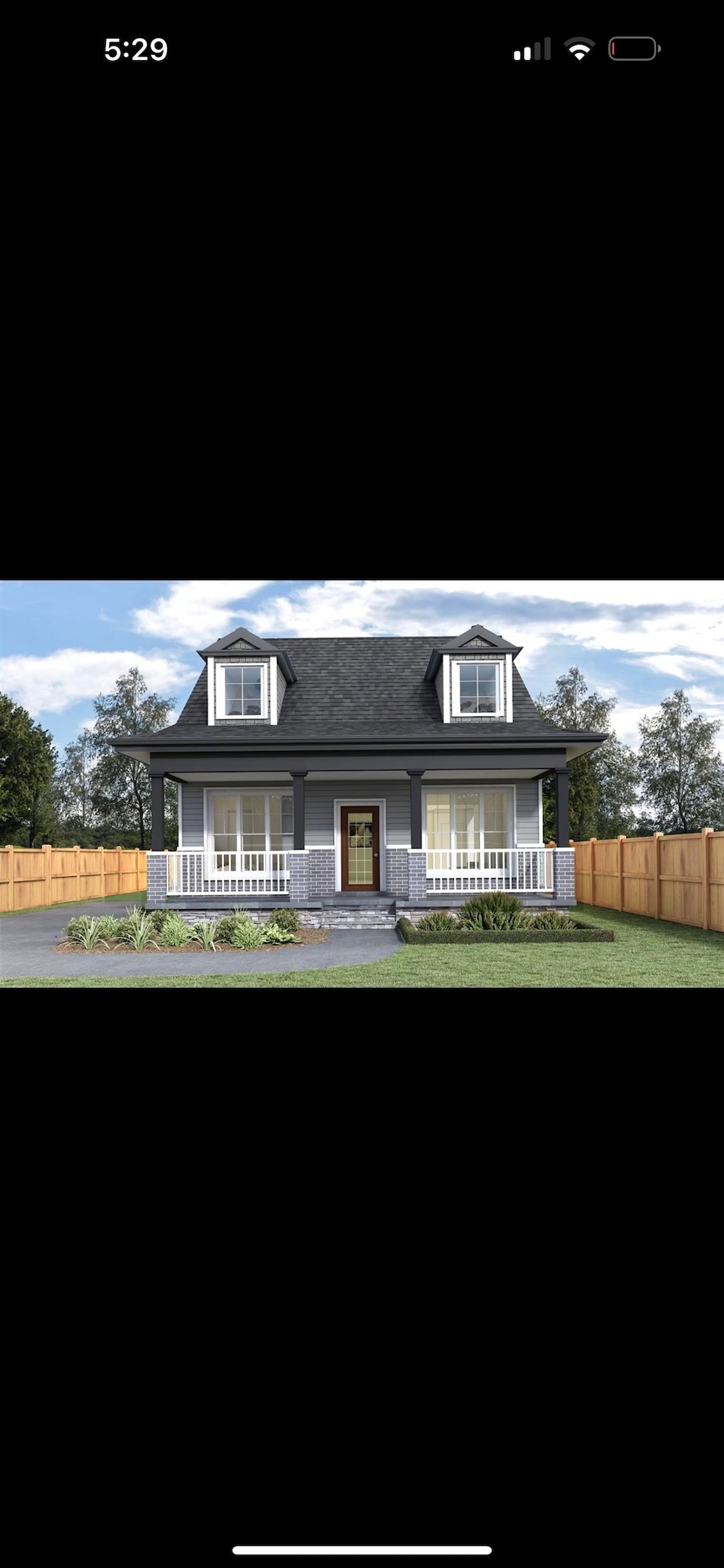 view of front facade with covered porch and a front yard