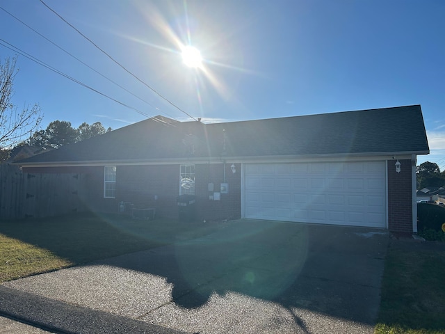 single story home with a garage