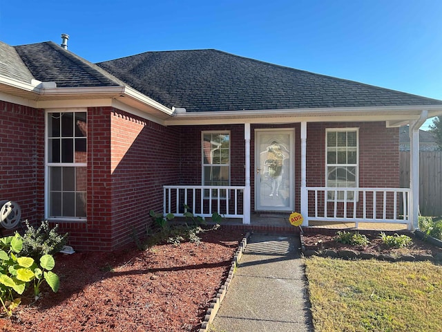 property entrance featuring covered porch