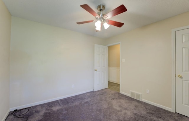 unfurnished bedroom featuring light carpet and ceiling fan