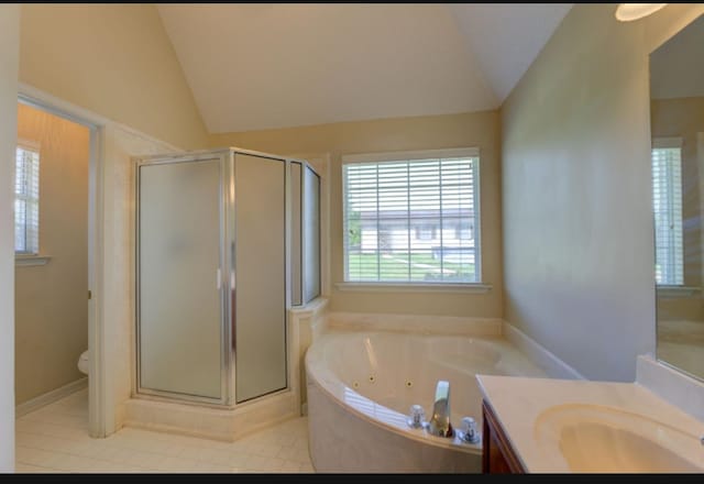 full bathroom featuring vanity, toilet, independent shower and bath, and lofted ceiling