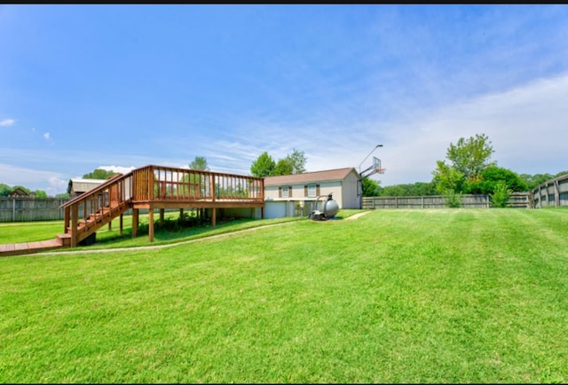 view of yard with a storage shed and a deck