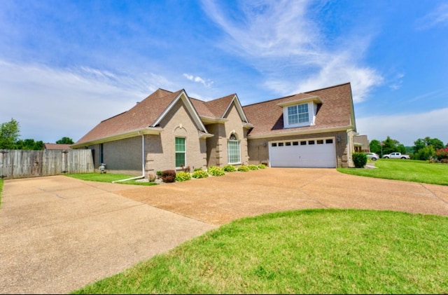 view of front facade featuring a front lawn and a garage