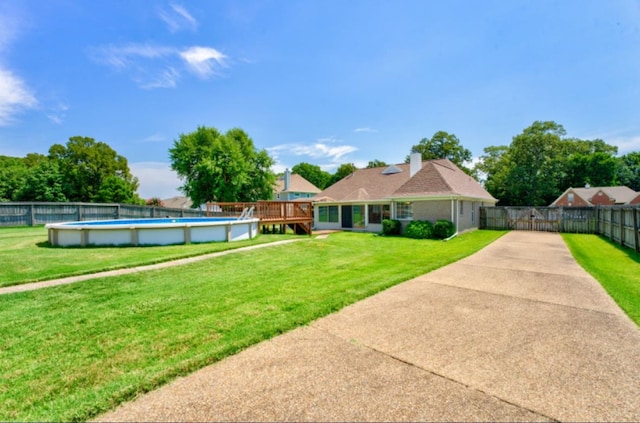 view of yard with a fenced in pool