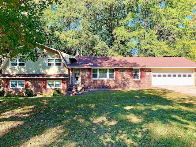 tri-level home featuring a front lawn and a garage