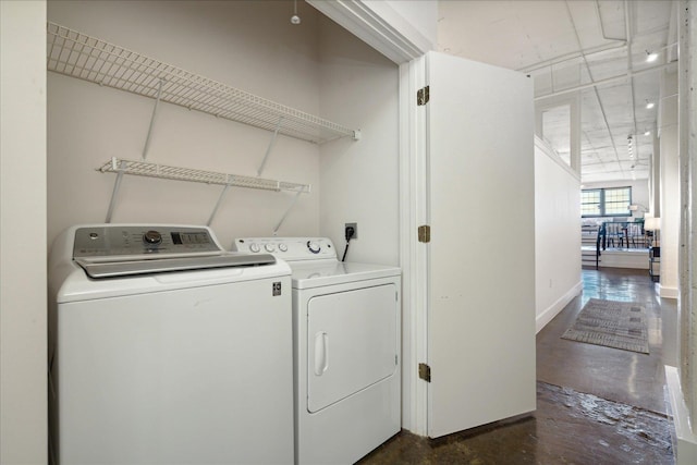 washroom featuring washer and dryer