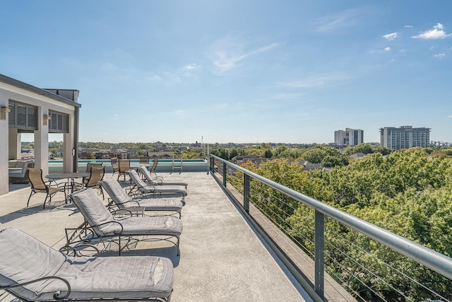 view of patio featuring a balcony