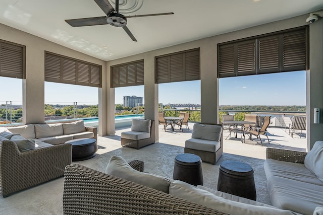 view of patio / terrace with a water view and an outdoor hangout area