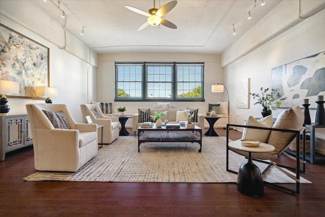 living room featuring ceiling fan, dark wood-type flooring, and rail lighting