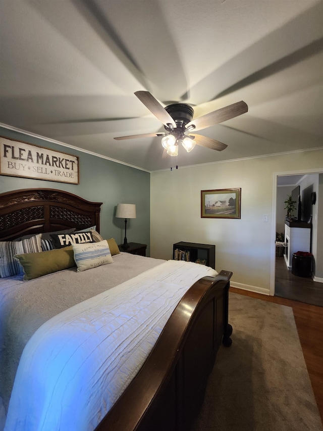 bedroom with crown molding, dark hardwood / wood-style floors, and ceiling fan