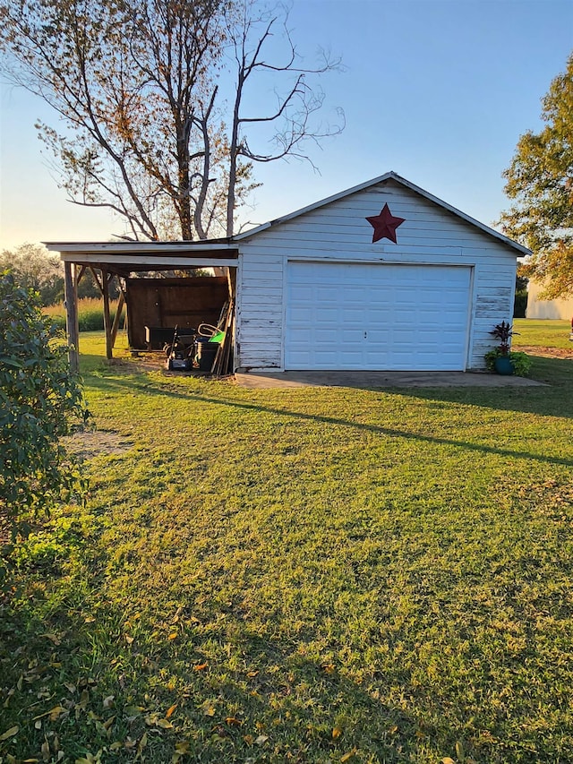 garage featuring a lawn