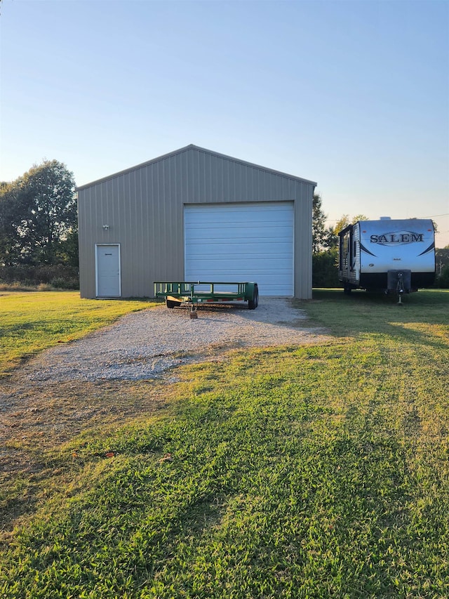 garage with a yard