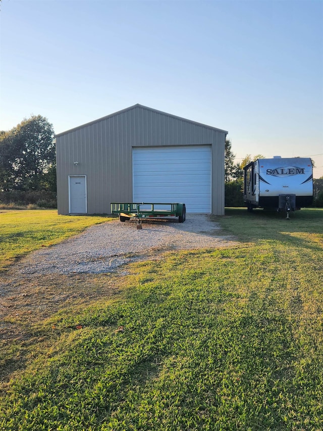 garage featuring a yard