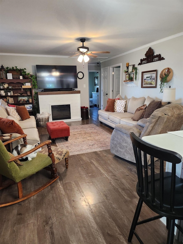 981 Durhamville Rd, Ripley, TN 38063 - living area with ornamental molding, a ceiling fan, and wood finished floors