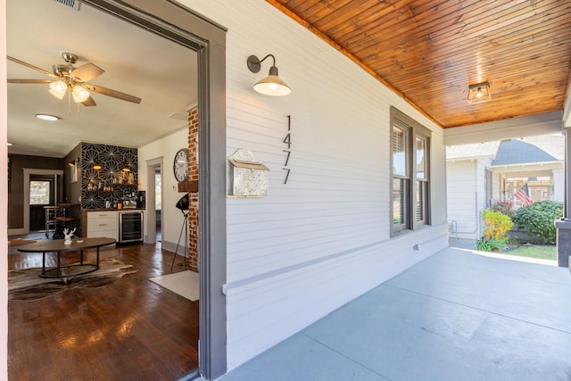 interior space featuring wine cooler and ceiling fan