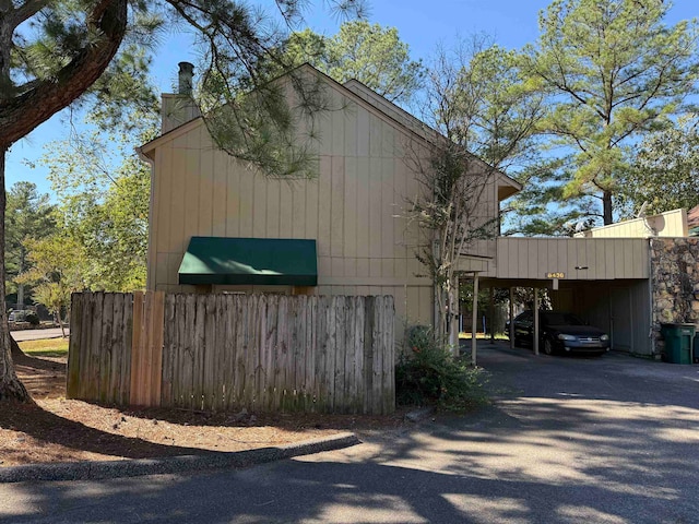 view of home's exterior with a carport