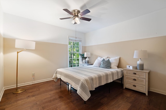 bedroom with ceiling fan and dark hardwood / wood-style flooring