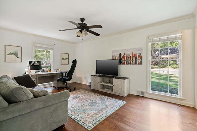 living room with ceiling fan, ornamental molding, a baseboard radiator, and hardwood / wood-style floors