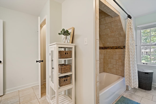 bathroom featuring shower / tub combo with curtain and tile patterned flooring