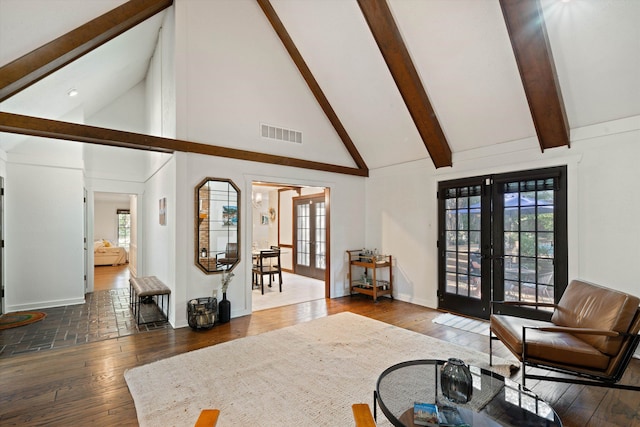 living room with beamed ceiling, french doors, dark hardwood / wood-style floors, and high vaulted ceiling