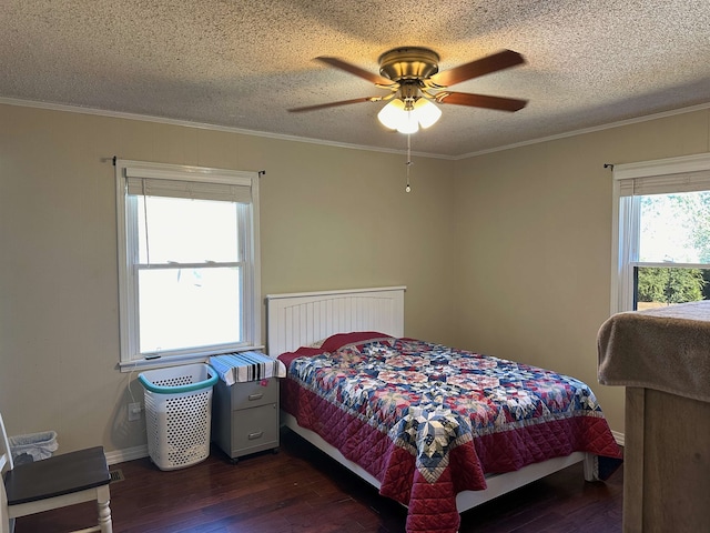 bedroom featuring ornamental molding, ceiling fan, a textured ceiling, and dark hardwood / wood-style flooring