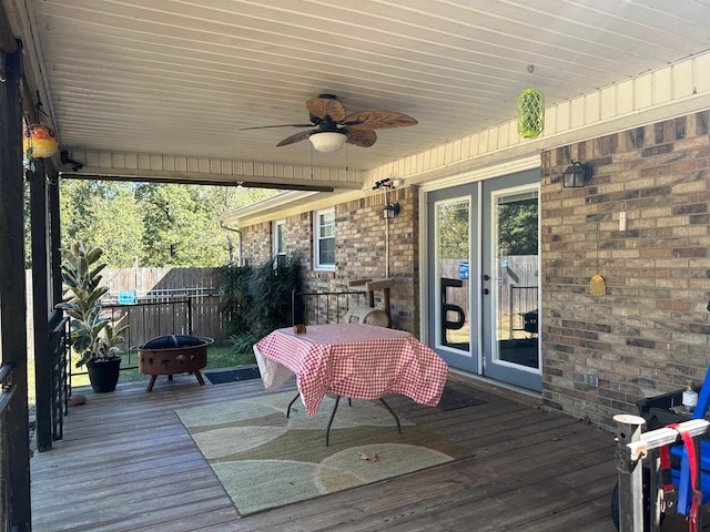 deck with french doors and ceiling fan