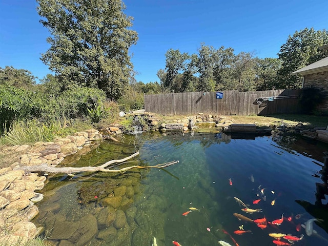 property view of water with a garden pond