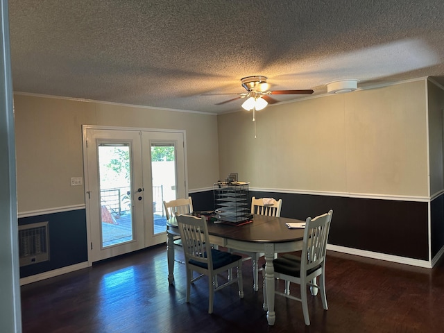 dining area featuring french doors, ornamental molding, dark hardwood / wood-style flooring, a textured ceiling, and ceiling fan