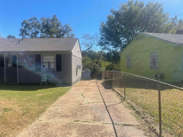 view of side of home featuring a lawn