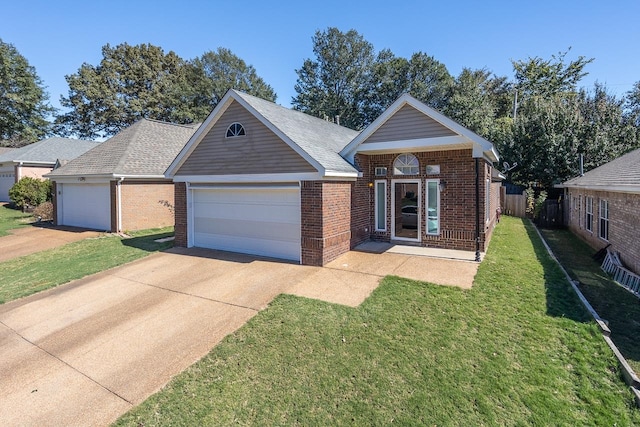 view of front of home with a front yard and a garage