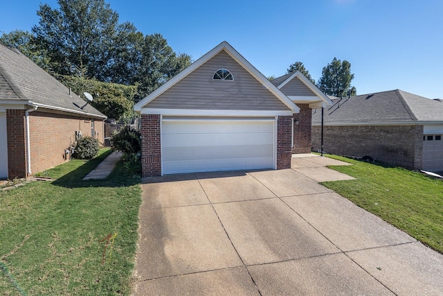 view of front of house with a front yard and a garage