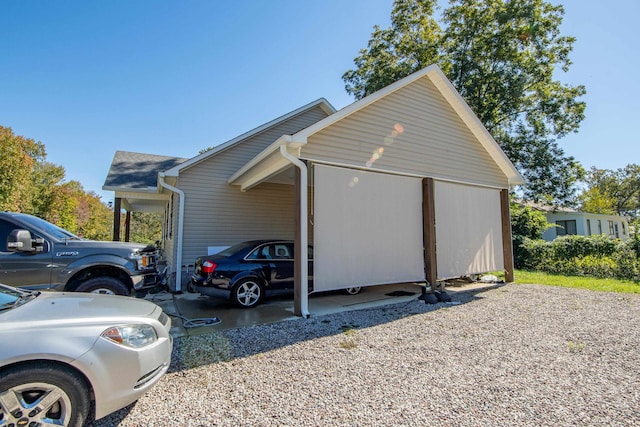 view of side of property with a carport