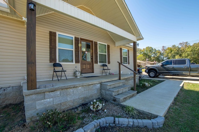 entrance to property with a porch