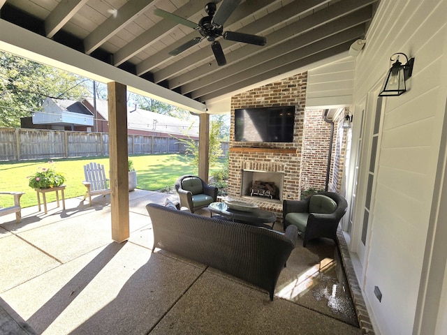 view of patio / terrace featuring an outdoor brick fireplace and ceiling fan