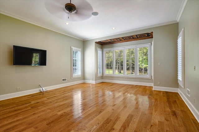 unfurnished living room with light hardwood / wood-style flooring, ornamental molding, and ceiling fan