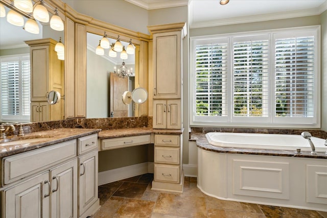 bathroom featuring vanity, crown molding, a chandelier, and a bathing tub