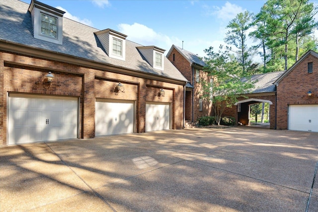 view of side of property featuring a garage