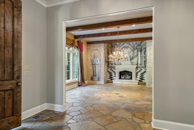 foyer entrance with beam ceiling, crown molding, and a notable chandelier