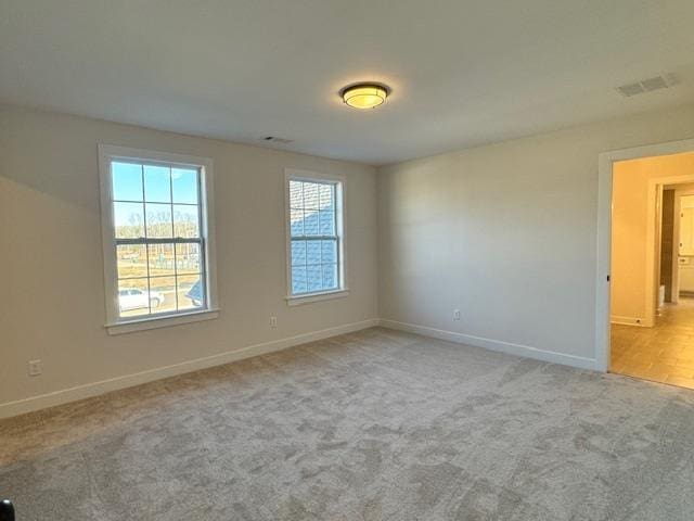 view of carpeted spare room