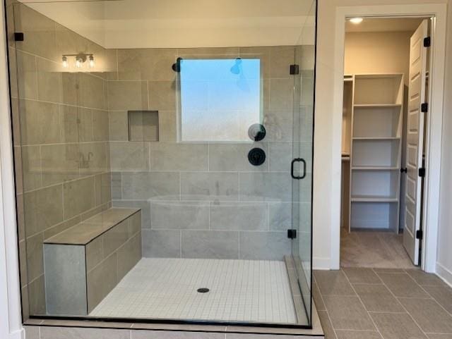 bathroom featuring tile patterned floors and walk in shower