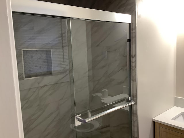 bathroom featuring vanity and walk in shower