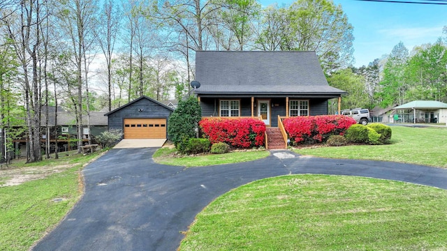 10 Rising Sun Ln, Counce, TN 38326 - view of front facade featuring an outdoor structure, a front lawn, a garage, stairway, and covered porch