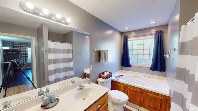 bathroom featuring vanity, a bathtub, wood-type flooring, and toilet