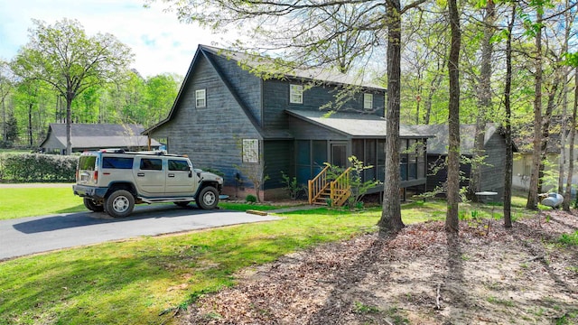 10 Rising Sun Ln, Counce, TN 38326 - view of property exterior featuring a sunroom and a yard